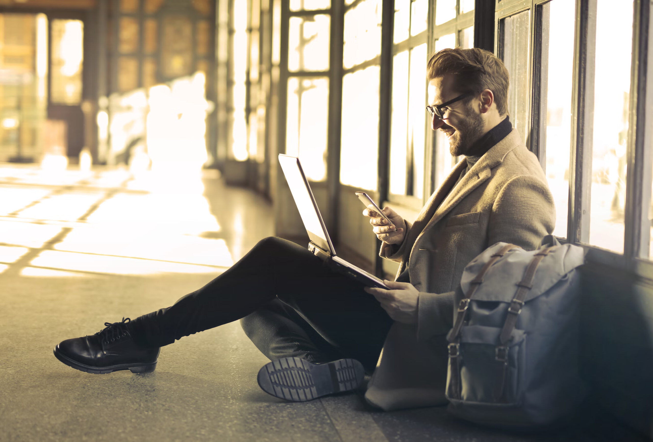 a man sitting on the floor doing an interview with a global hiring agency