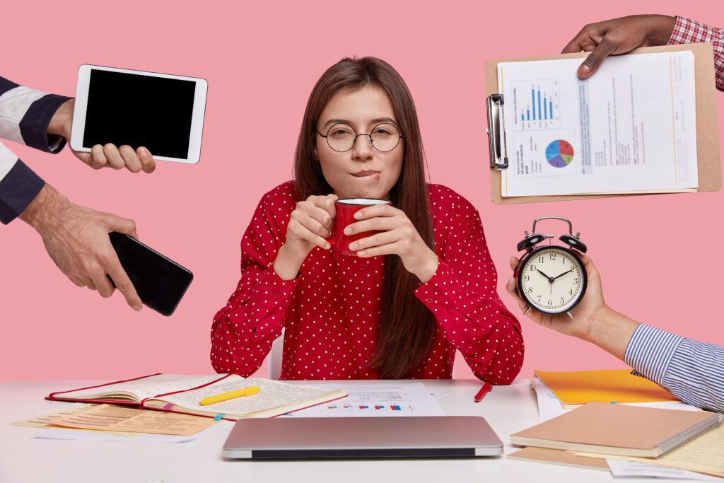 a woman multitasking thinking about how to hire a virtual assistant