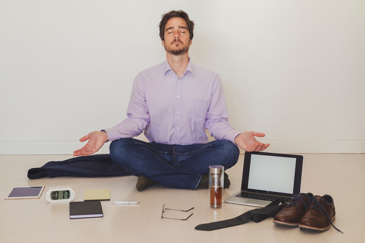 a businessman meditating delegating everything to a virtual assistant